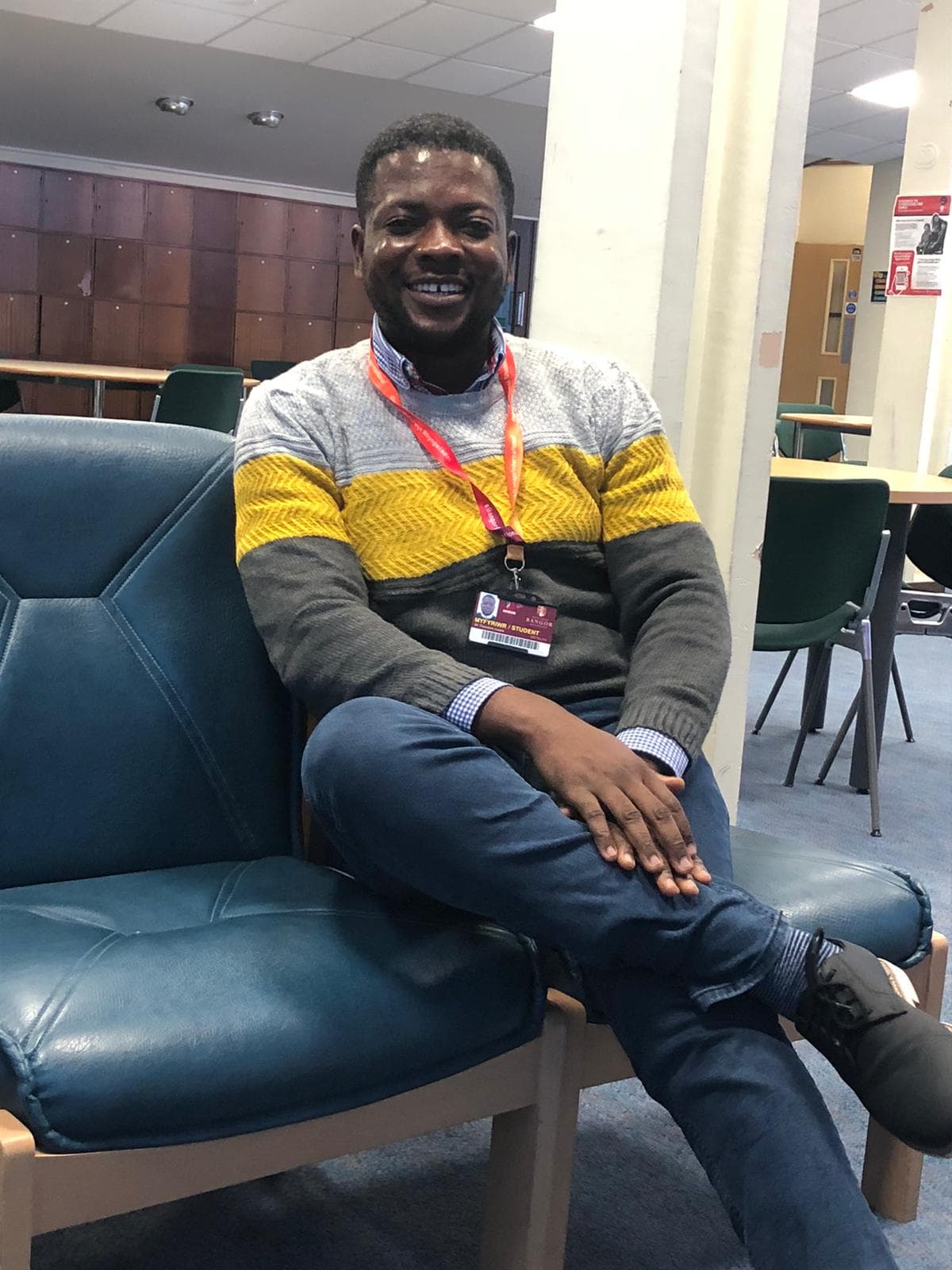 Theodore Aware in a university common room